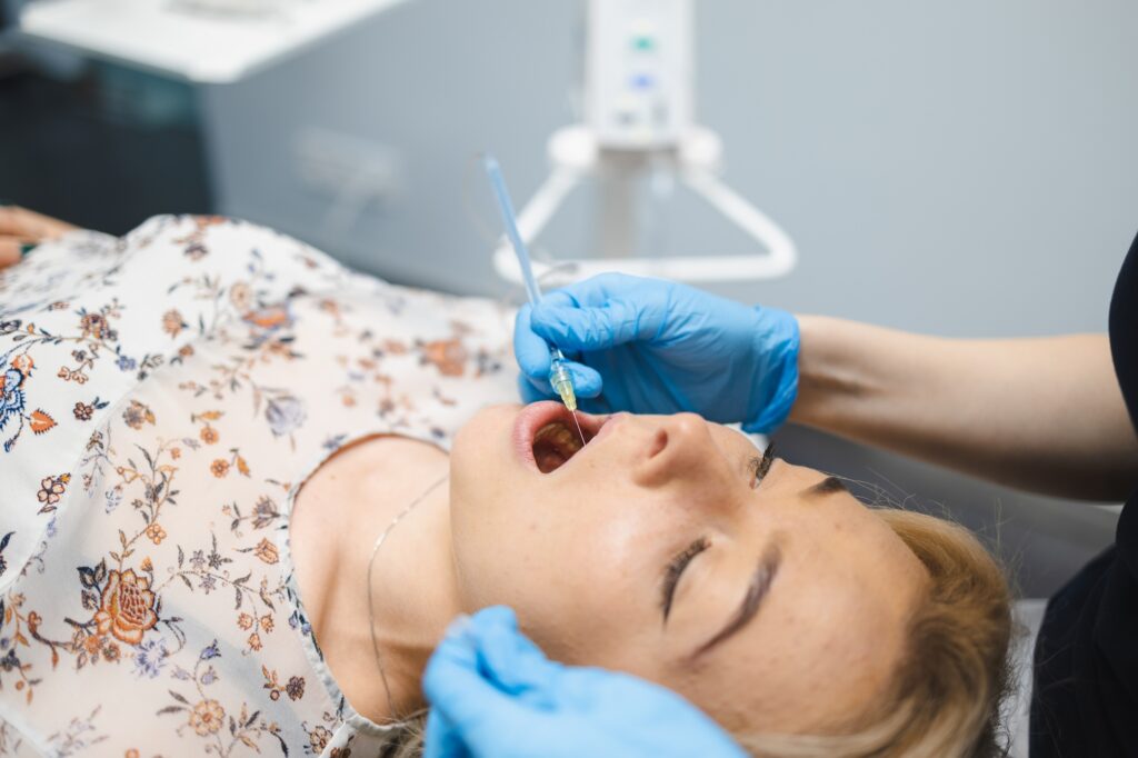 Dentist injection anesthetic using modern STA method. Pain free dental treatment